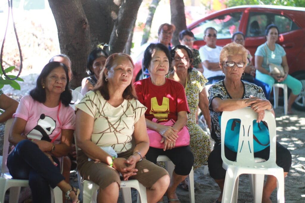 Senior citizens gathered for a partner church ministry activity